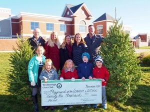 Gathered at a $25,000 check presentation from the Westborough Civic Club (WCC) to the Westborough Tot Lot Committee (WTLC) are (back, l to r) Steve Hart, WCC vice president; Erica Dube, WTLC chair; Jennifer Strong, WTLC vice chair; Megan McDonald, WTLC secretary/treasurer; and Adam Boyce, WCC president; with (front, l to r) Kaylie Strong, 9; Ariana Dube, 4; Kaitlyn Strong, 4; Connor McDonald, 6; and Brendan McDonald, 4.