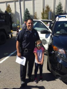 Auburn Police Officer Bryan Porcaro and  5-year-old Renée Monaghan of Westborough. (Photo/submitted)