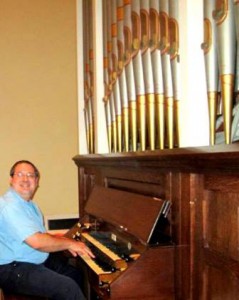 Leonardo Ciampa with the church’s 1895 Ryder organ (Photo/submitted)
