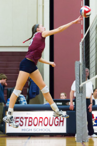 Westborough’s Gianna Scioletti flies through the air as she tips the ball over the net.