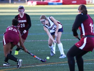 Westborough sophomore Caitlin McCarthy takes a shot on goal as Fitchburg defenders look on.