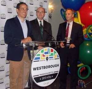 Matt Dunne, Google's head of community affairs (left) speaks at a ceremony honoring Westborough as Google's 2013 eCity of Massachusetts as U.S. Rep. James McGovern, D-2nd (center) and Westborough Town Manager Jim Malloy (right) listen.  Photo/Bonnie Adams  