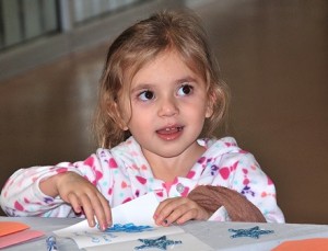 Arianna Maggio, 4, completes her card to Santa. Macy’s donated $1 per card to the Make-A-Wish Foundation.