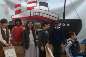 Second-graders at Fales Elementary School disembark from the ship bringing them to America.