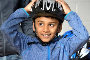 Shravan Dilip, 7, gets a free bike helmet. Photo/Ed Karvoski Jr.
