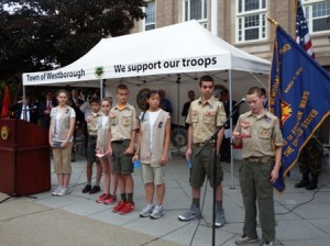 Girl Scouts and Boy Scouts read the names of veterans who died in 2013. 
