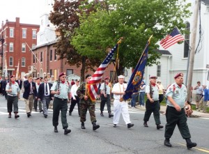 A color guard marches in the parade. 
