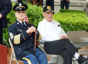 Veterans Luis Torres and William Carr listen to the guest speakers. 