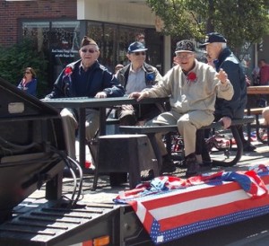 Veterans get a ride in the parade courtesy of E.L Harvey and Sons. 