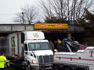 Officials hope the new warning system will help to reduce the number of trucks that end up stuck under the CSX bridge.