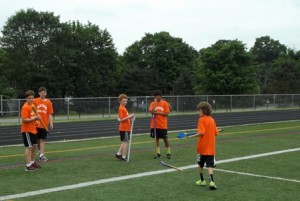 Campers prepare to compete in the javelin event.