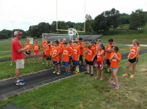 Coach Roger Anderson instructs campers at the Westborough Track & Field Clinic.