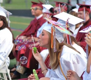 Margo Murphy adds bubbles to the graduation ceremony.  