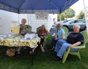 Members of the Congregational Church of Westborough (from left) Carolyn Bent, Jean Newton and Nancy and Harrison Cook volunteer at the welcome table.