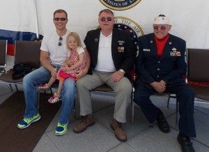 Selectman Denny Drewry (middle) poses for a photo with his son, Scott, granddaughter Madison, 4 and George Perry. 