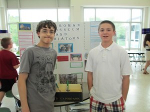 7th grade Latin students Jeremiah Hall and Evan Doherty display their gladiator-inspired-dice game.  