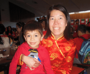 Anne Lee, wearing a traditional outfit from Hong Kong, with her son, Evan, 5. (Photos/Nance Ebert)