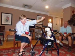 Bob watches Tania and Lynsey Lu perform for the residents at the Salmon Health and Retirement complex in Westborough.  Photo/Bonnie Adams 