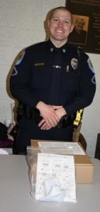 Police officer with drug testing kits