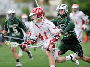 St. John's High School's Hunter Burdick (#41, left) is chased by Grafton High School's Mike Schena (#16, right).