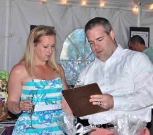 Laura and Edward Sudnick place a bid at the silent auction.